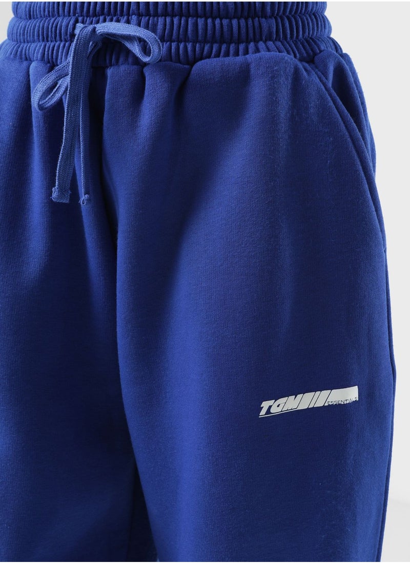 The Giving Movement - Oversized Racer Printed Joggers - Image 1