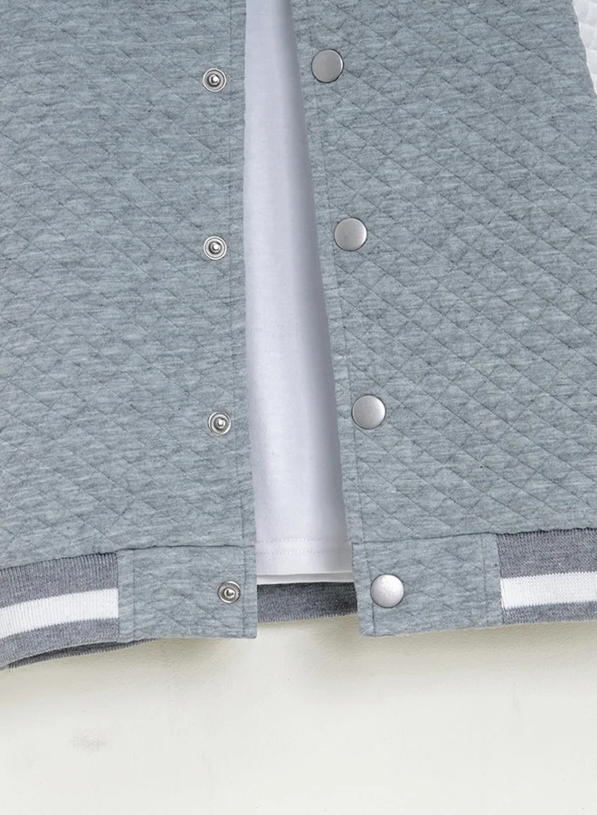 تايك تو جاكيت بلون رمادي بنمط كتل الألوان مزود بأزرار
