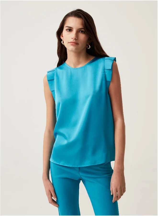 او في اس Sleeveless blouse with ruffles