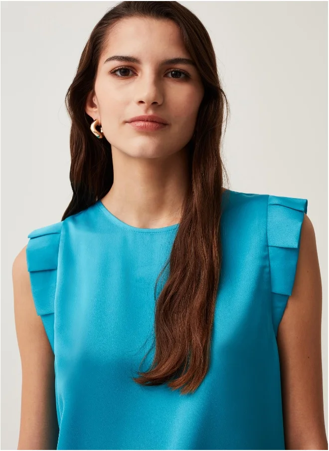 او في اس Sleeveless blouse with ruffles