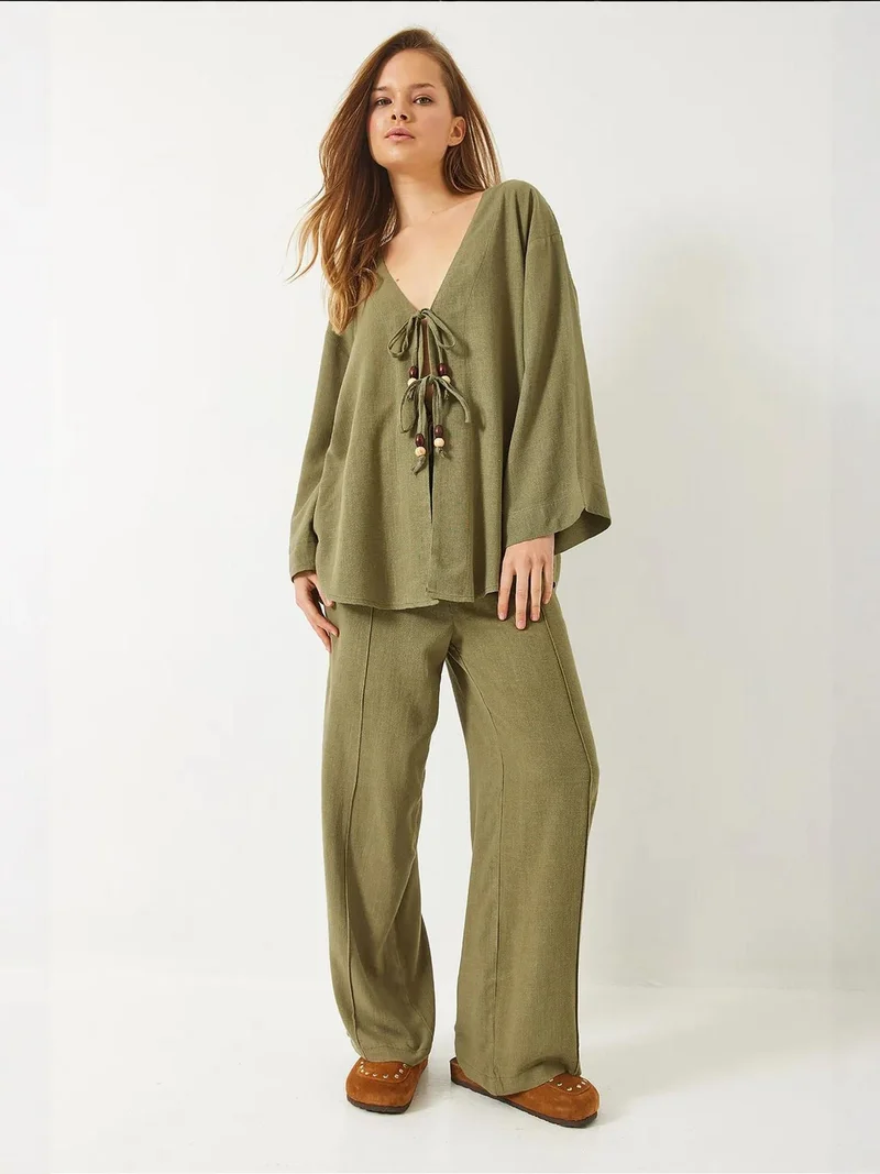 بيانكو لوتشي طقم تونيك برقبة على شكل حرف  بنقوشات عريضة وسروال واسع