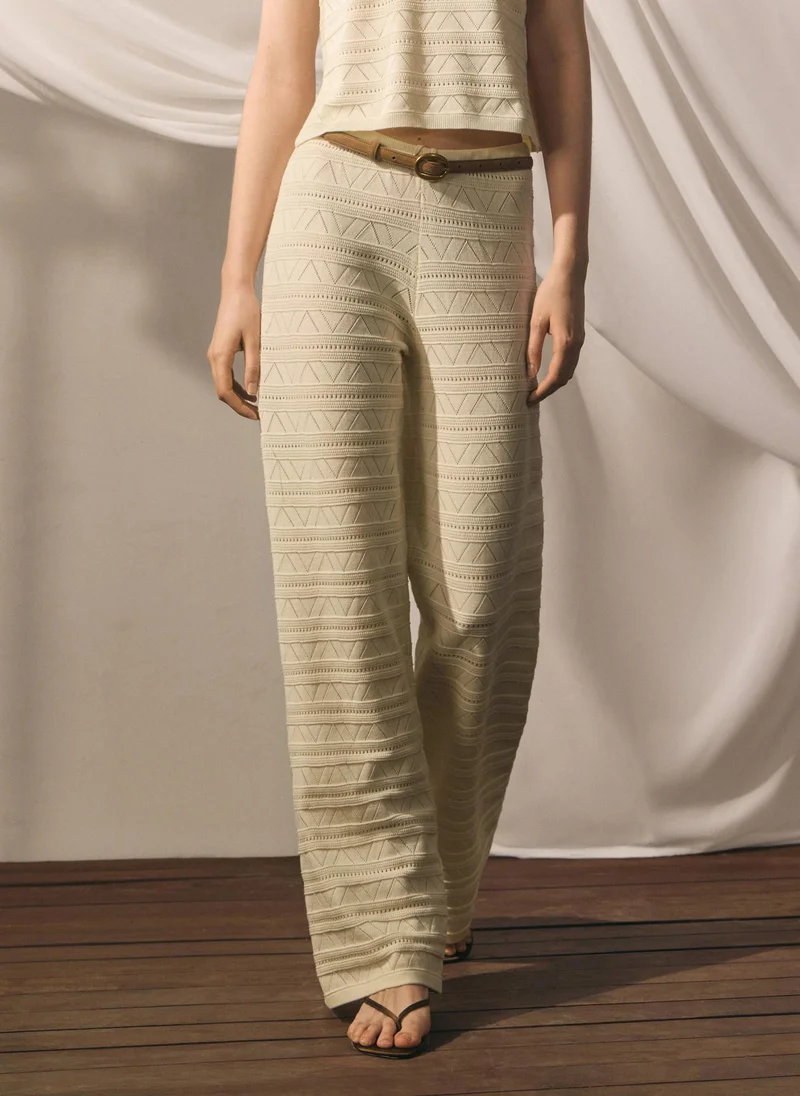 Knitted trousers with geometric pattern