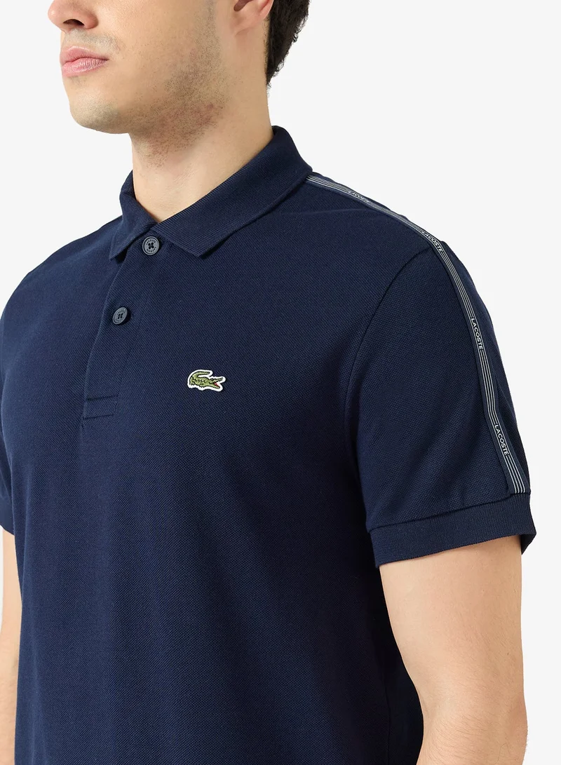 LACOSTE  Regular Fit Striped Band Piqué Polo for Men | Best Price UAE
