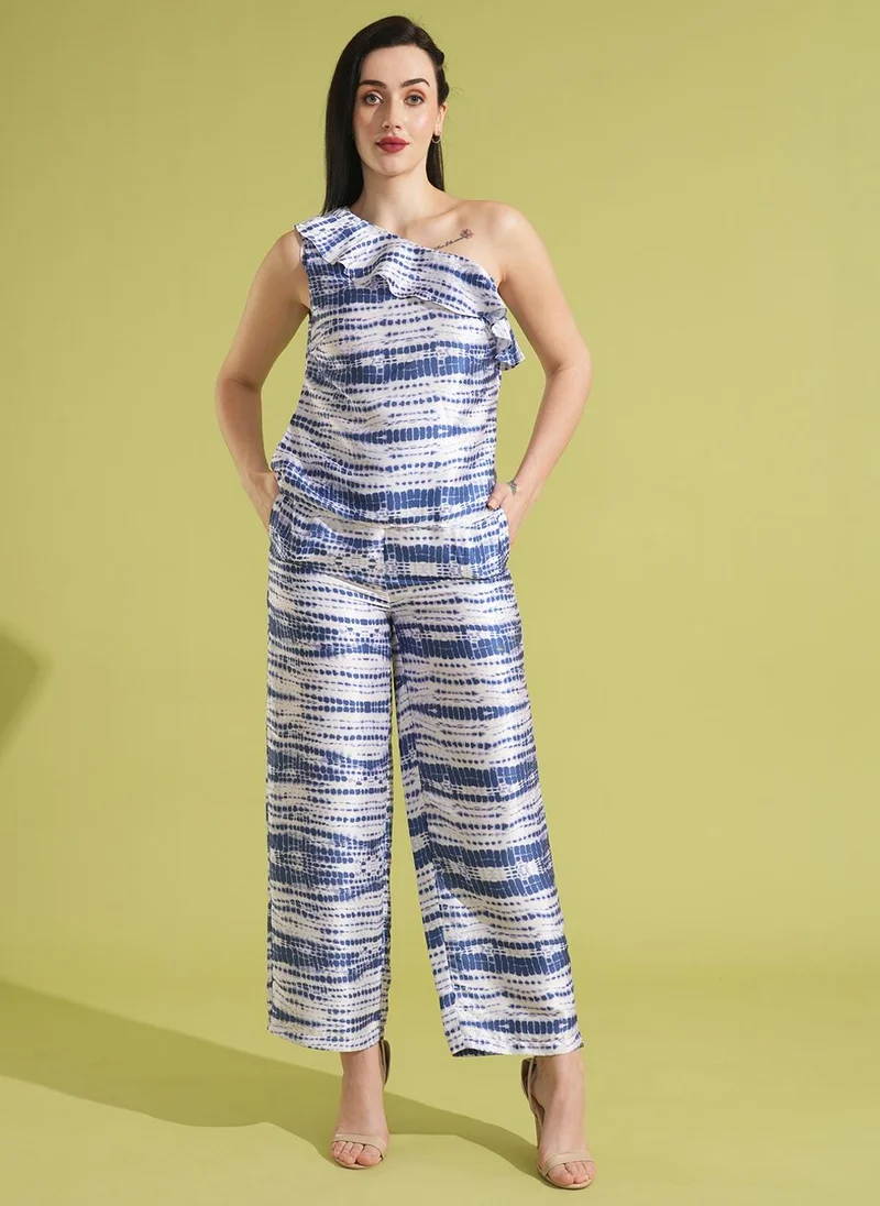 جلو باص بلوزة بكتف واحد بطبعة تجريدية مع بنطلون نسائي من جلوبس