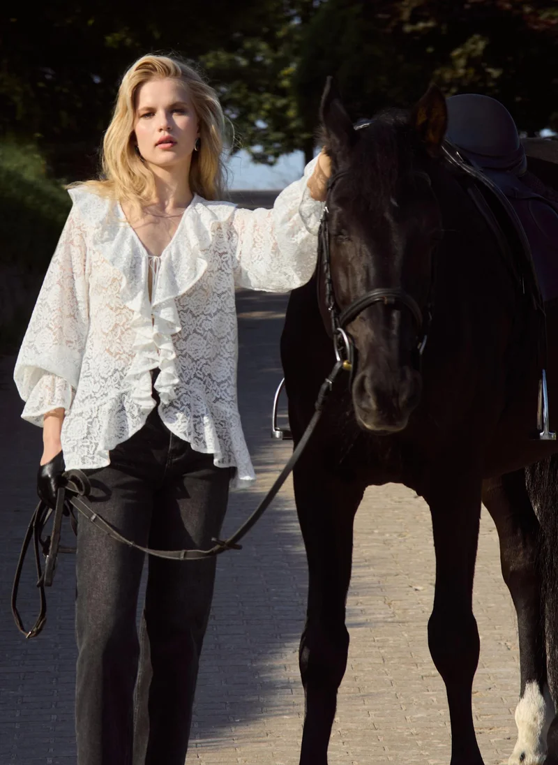 Lichi Openwork blouse with voluminous flounces on the collar