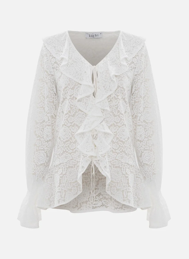 ليتشي بلوزة مخرمة مع كشكشة ضخمة على الياقة