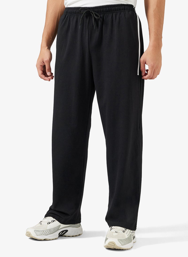 سفنتي فايف بيسيكس بنطلون رياضي فضفاض بخصر مطاطي وجانب مخطط - Image 1