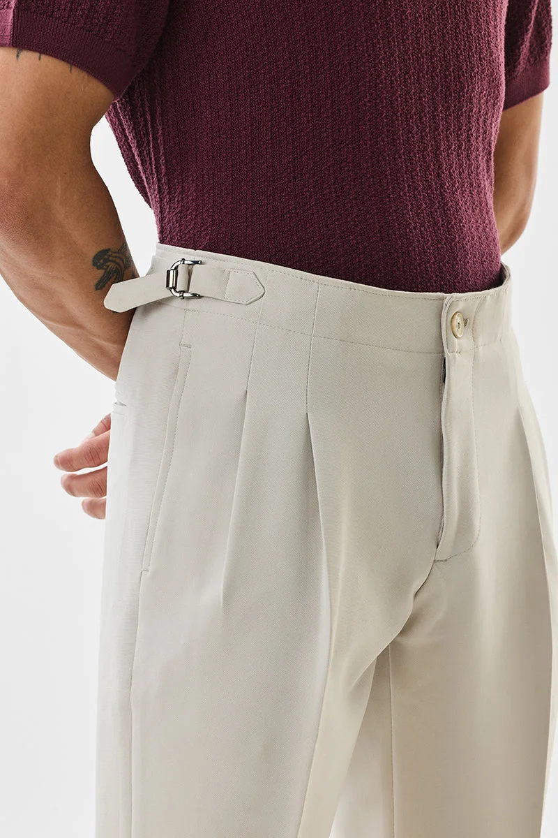 SNITCH بنطلون بيج بقصة ضيقة ومرونة