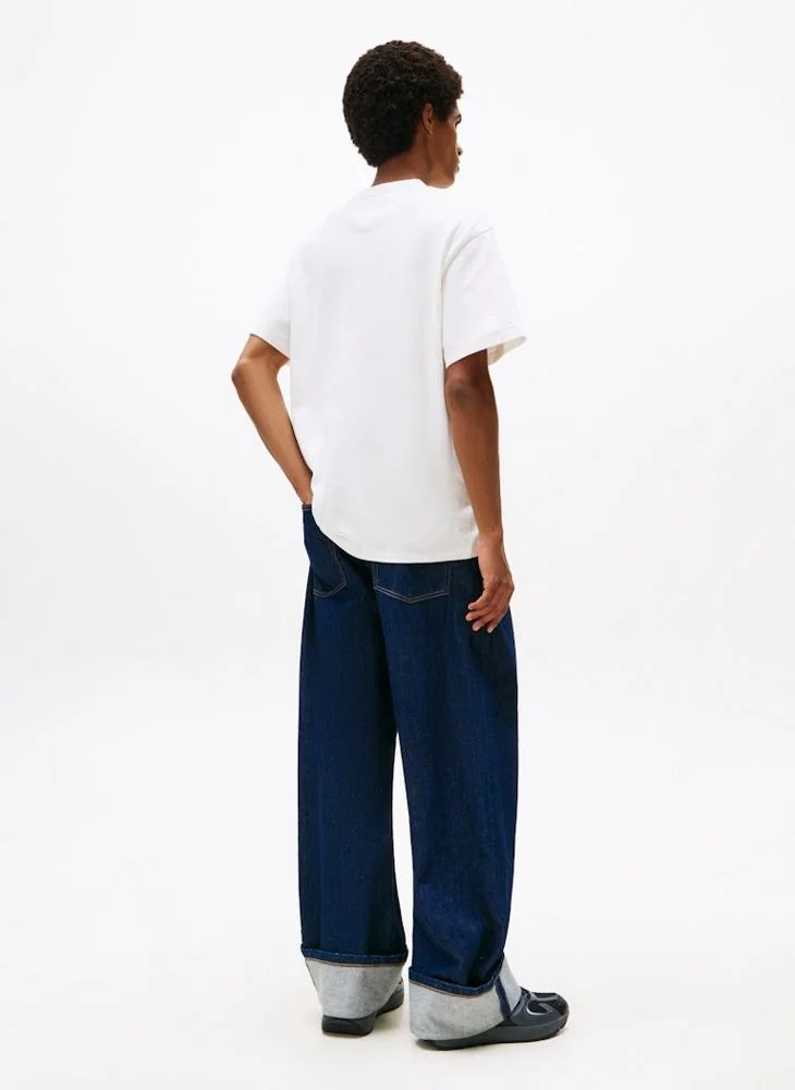 تومي جينز تيشيرت بياقة دائرية مزين بشعار العلامة التجارية