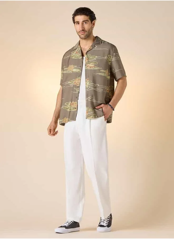 ايكونيك Iconic All-Over Lotus Print Camp Collar Shirt with Short Sleeves