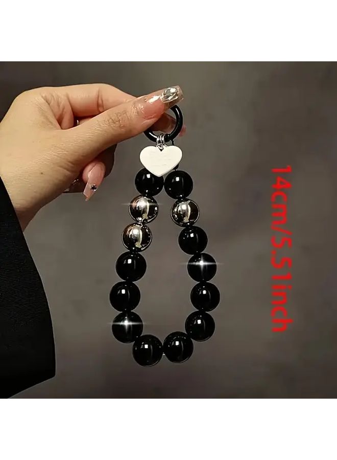Black Beaded Phone Wrist Strap with Golden Clasp and Heart Charm - Image 3
