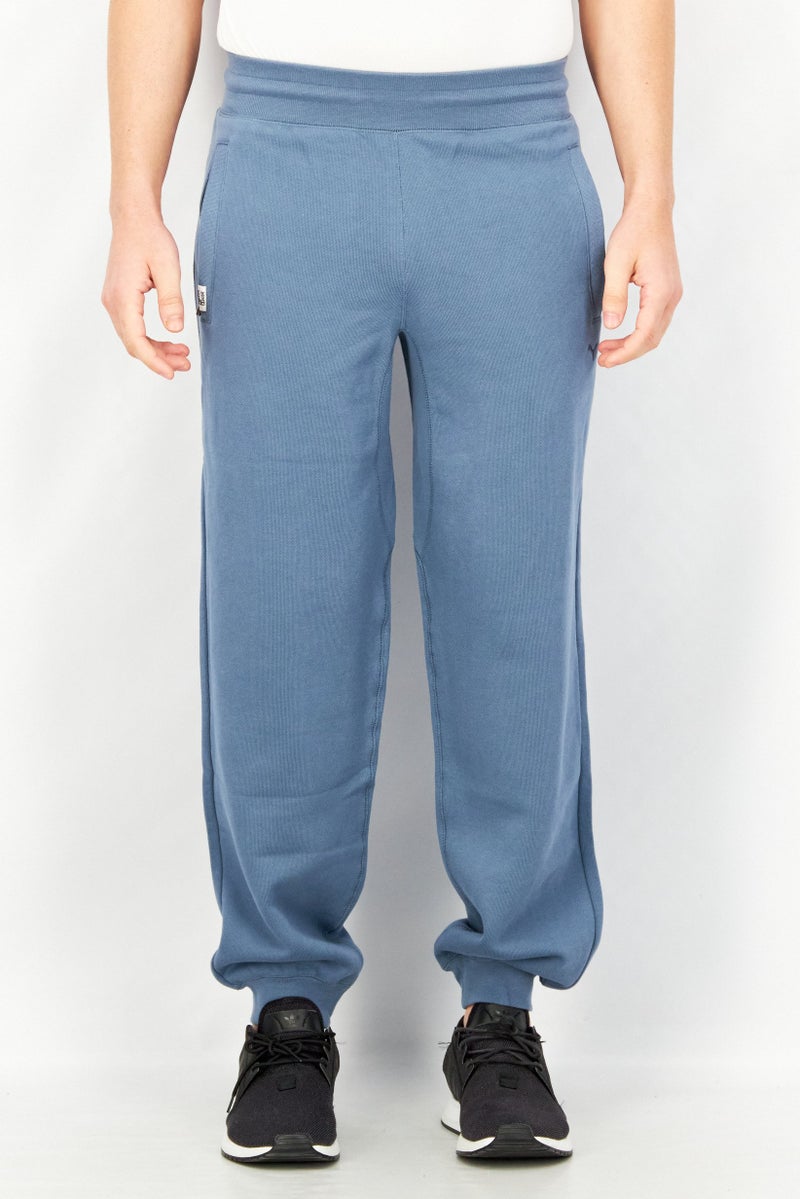 PUMA Men Sportswear Fit Brand Logo Training Jogger Pant, Blue - Image 1