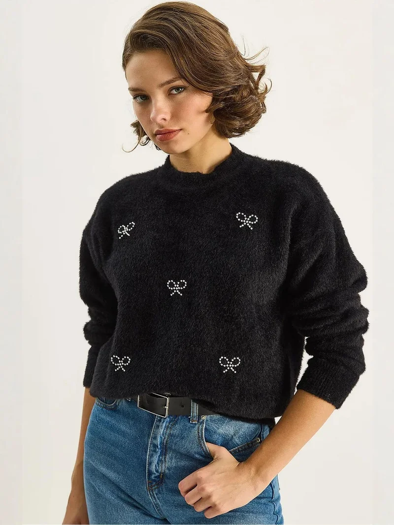 بيانكو لوتشي كنزة برقبة دائرية بنقش فيونكة