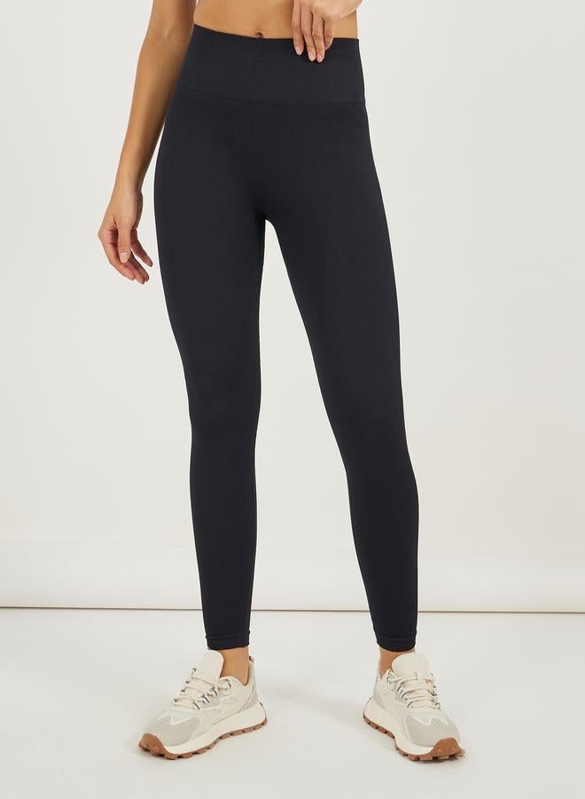 ستايلي اكتيف طقم كروب توب قصير بأكمام قصيرة وسحاب نصفي مع ليجنز - Image 4