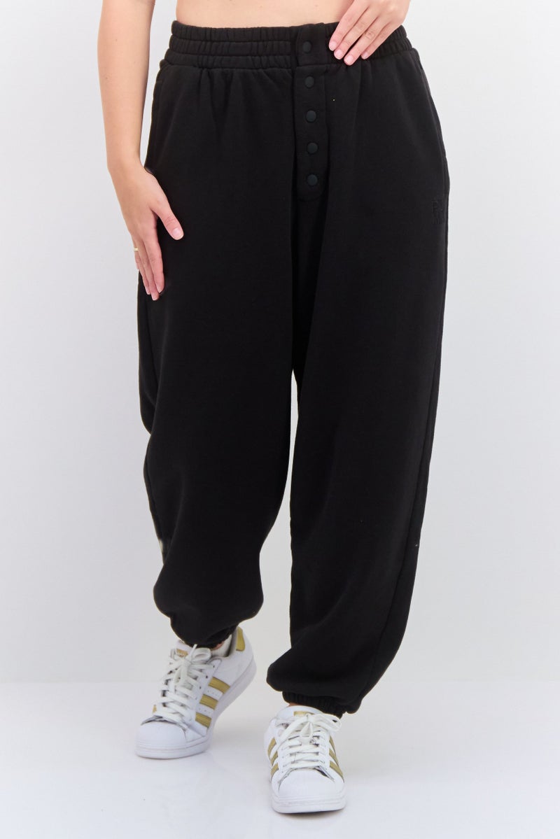 PUMA سروال رياضي خارجي مريح للنساء، أسود - Image 1