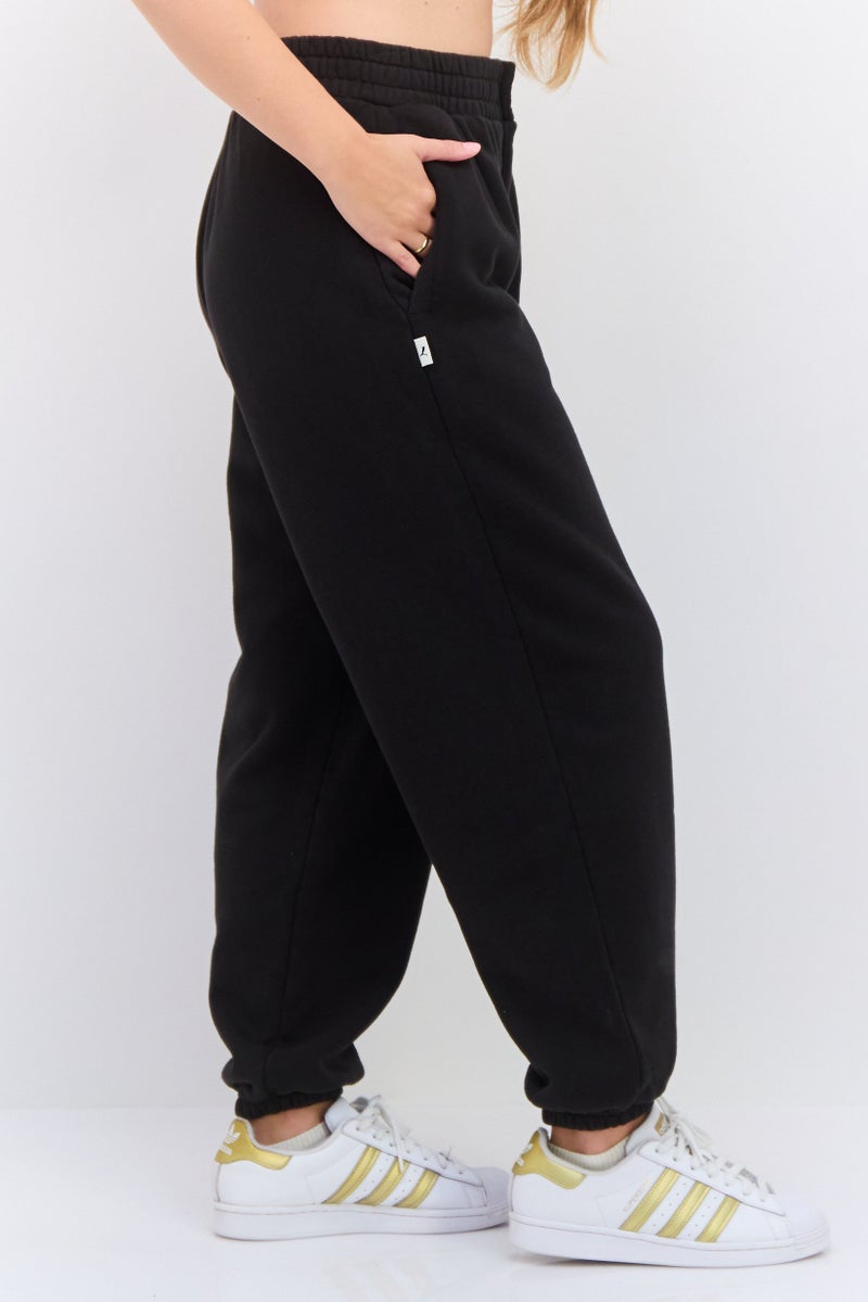 PUMA سروال رياضي خارجي مريح للنساء، أسود - Image 2