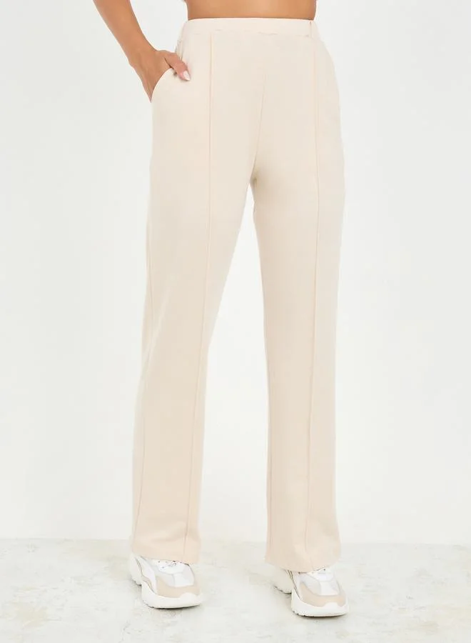 Styli Asymmetrical Hem T-Shirt & Straight Fit Pintuck Detail Pant Co-Ord