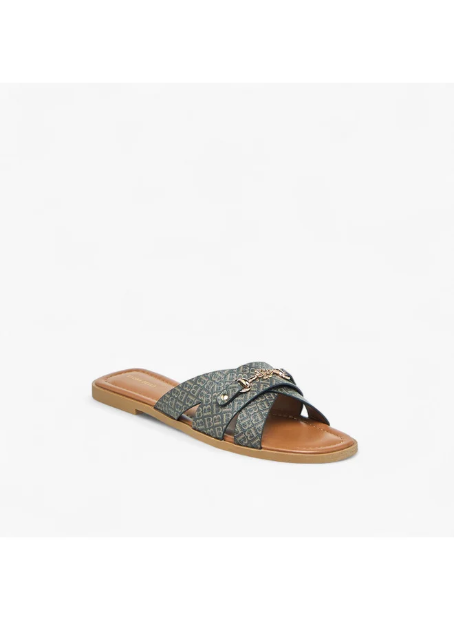 فلورا بيلا من شو إكسبرس Women Monogram Print Slip-On Flat Sandals with Metal Accent