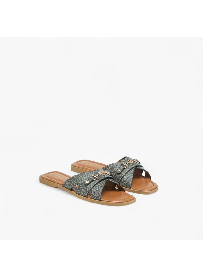فلورا بيلا من شو إكسبرس Women Monogram Print Slip-On Flat Sandals with Metal Accent