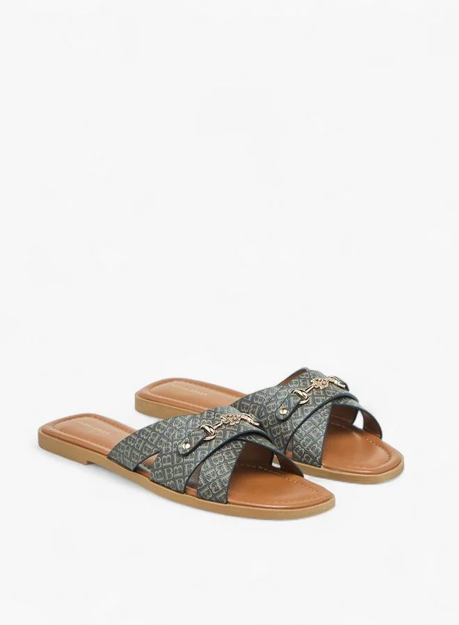 Flora Bella Monogram Print Slip-On Flat Sandals With Metal Accent