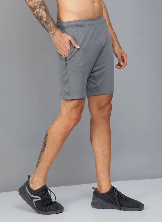 تكنوسبورت شورت سادة بجيب جانبي