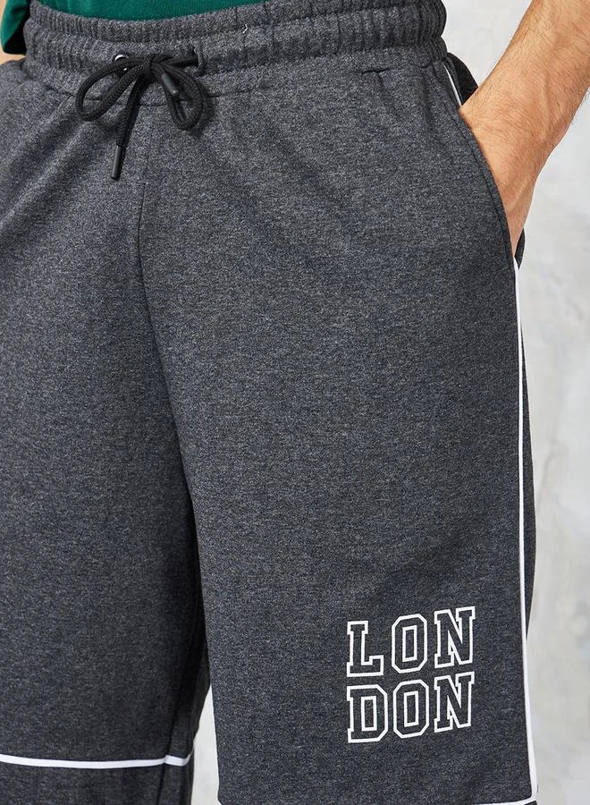 Styli Oversized Varsity Print Shorts with Contrast Piping