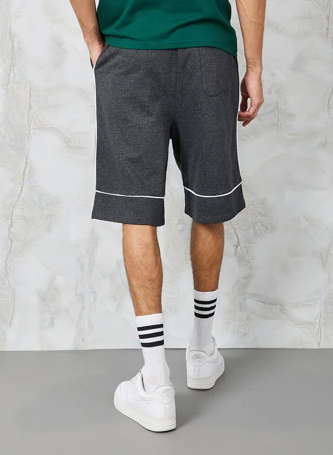 Styli Oversized Varsity Print Shorts with Contrast Piping