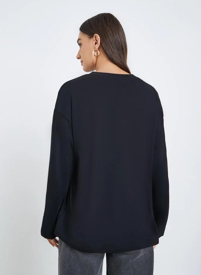 Styli Black Black Oversized Long Sleeve Side Slit T-Shirt for Women | Best Price UAE