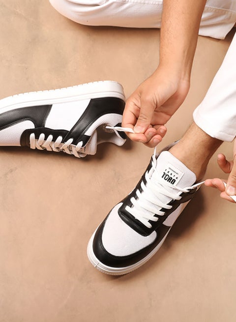 X7 Essential shoe padded with foam, crafted from leather and microfiber fabric