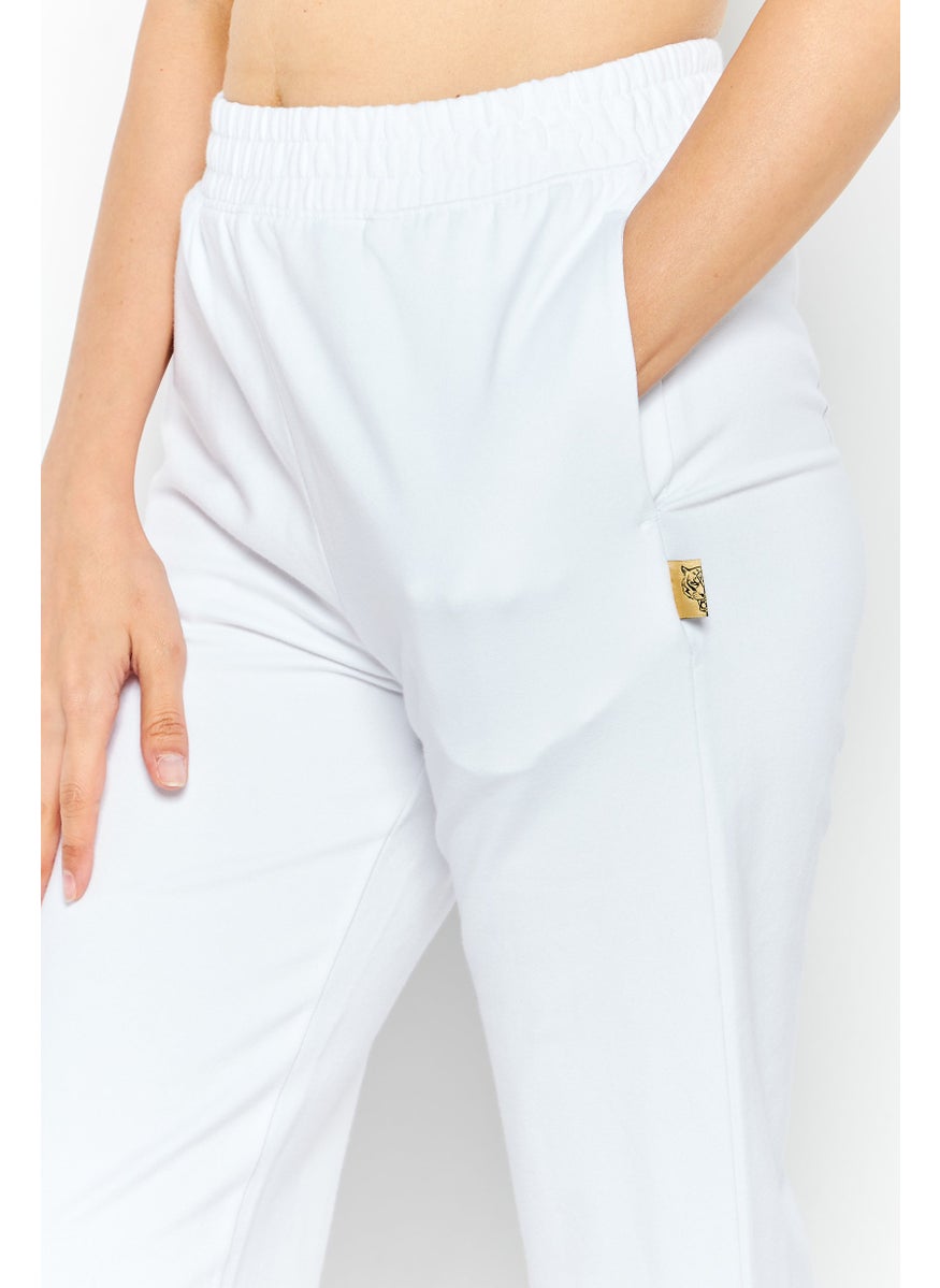 Women Sportwear Fit Brand Logo Training Track Pant, White - pzsku/Z82175D4463AB518C29AEZ/45/_/1724350914/43061e80-43ba-4215-bc8a-afa7d9aeadc6