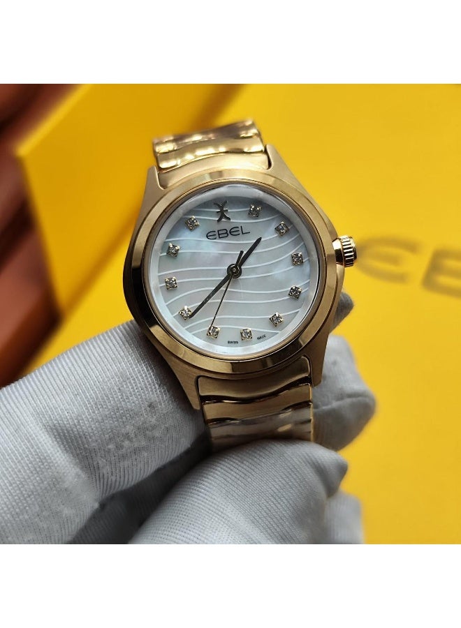 The Ebel women's watch features a classic design with a distinctive wave-shaped strap.