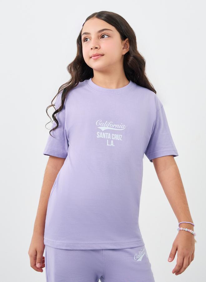 ستايلي طقم تي شيرت فضفاض بطبعة نص للبنات وسروال رياضي واسع الأرجل - Image 2