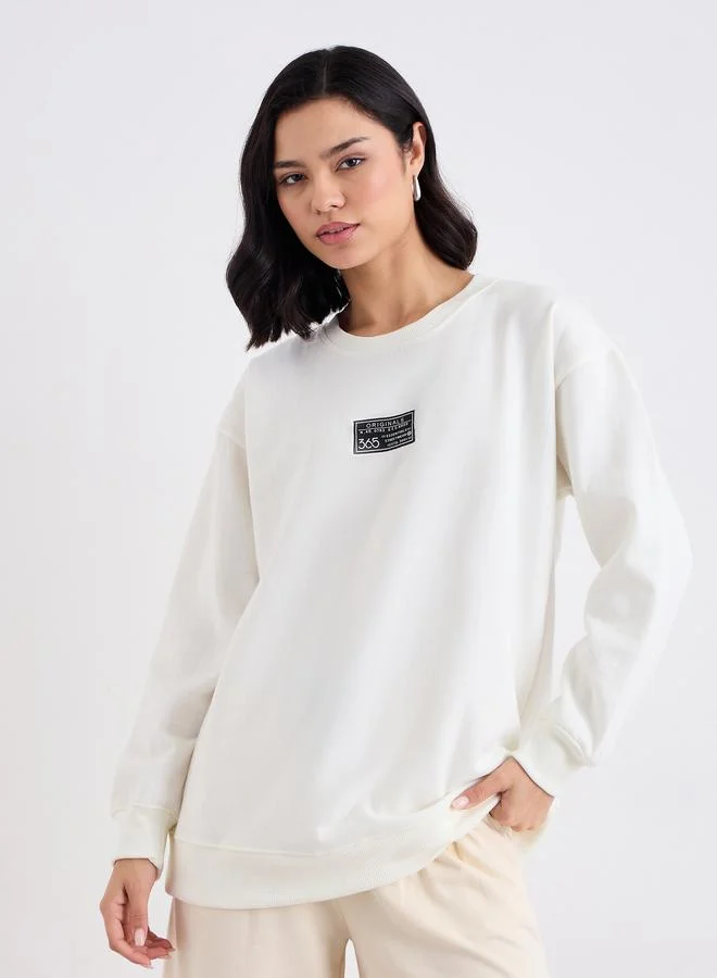 Styli Styli Off White Longline Sweatshirt with Badge Detail
