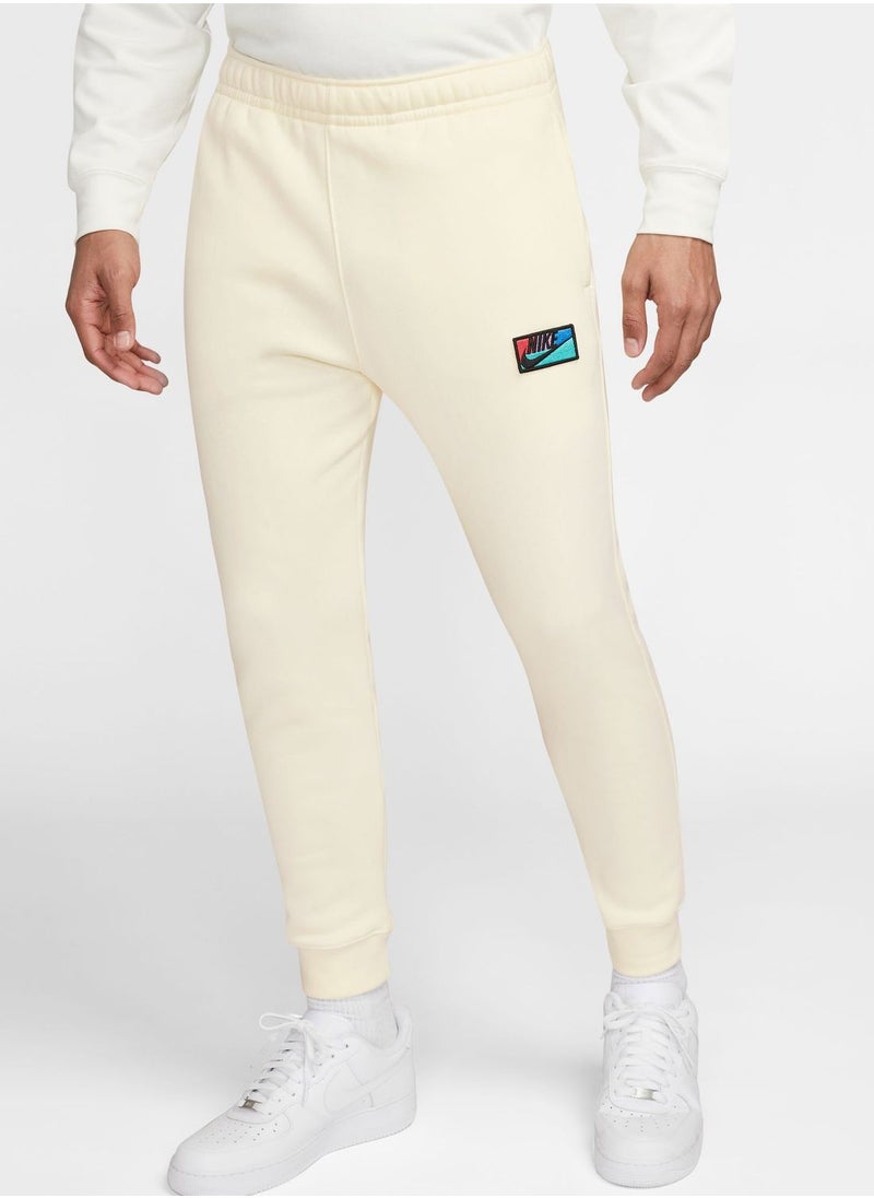 Nike - Club+ Patch Graphic Pants - Image 1