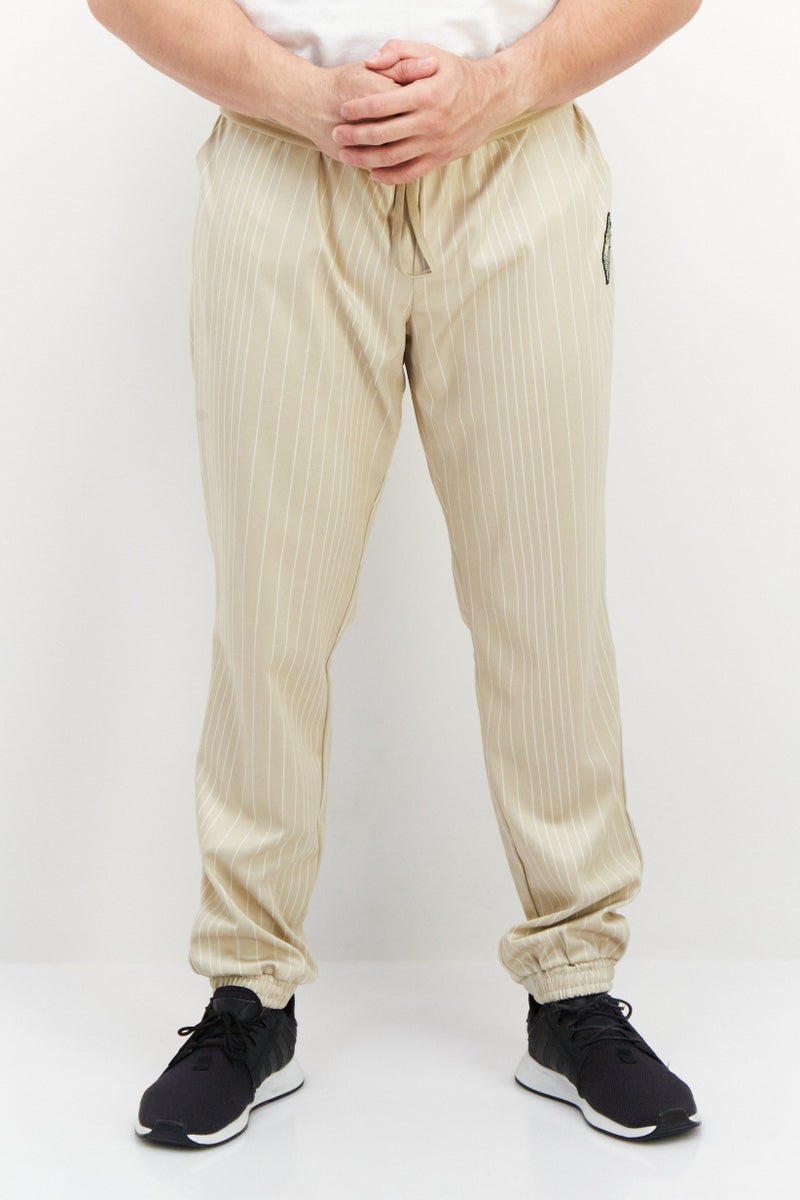 FILA Men Sportswear Fit Brand Logo Training Sweatpant, Beige  - Image 1