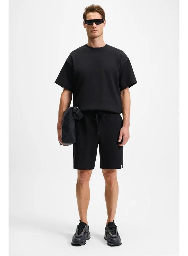 Grimelange BAILEY Men's Elastic Waist Single Pocket Corduroy Relaxed Fit Black Shorts.