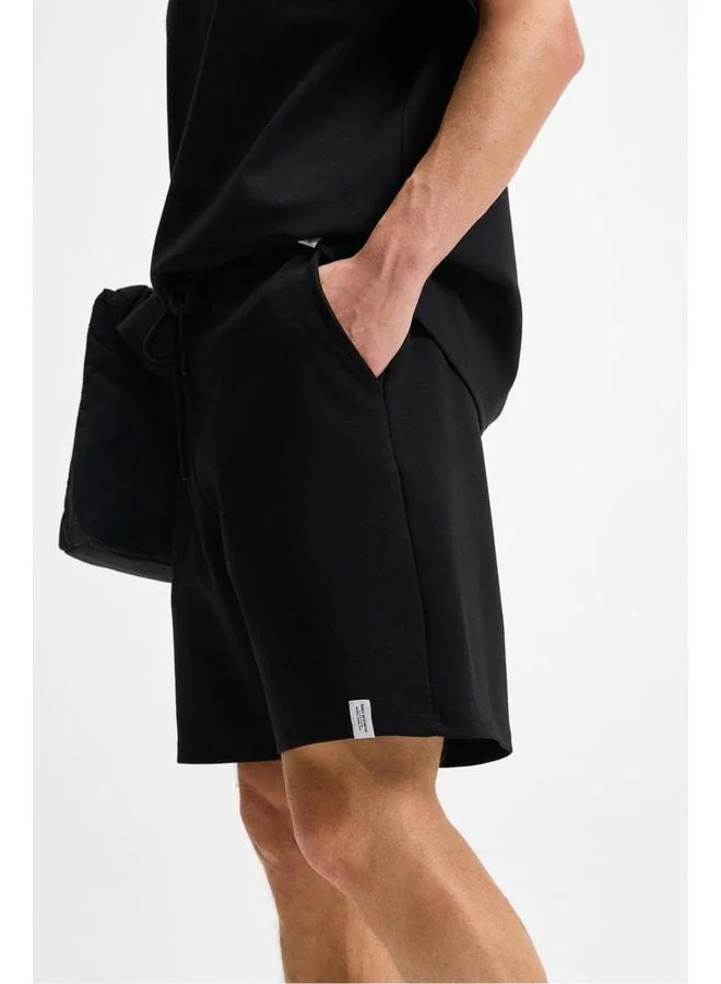 Grimelange BAILEY Men's Elastic Waist Single Pocket Corduroy Relaxed Fit Black Shorts.