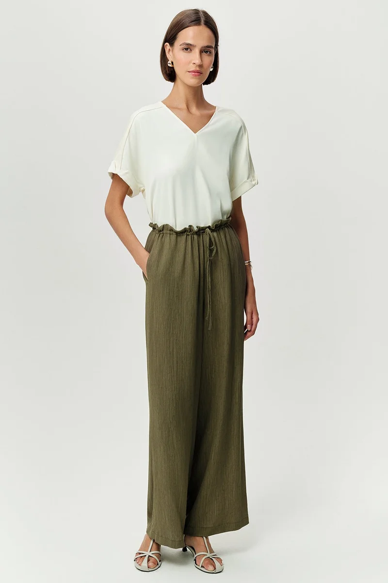 EXQUISE Wide-leg, regular woven khaki trousers with drawstring waist and pockets.