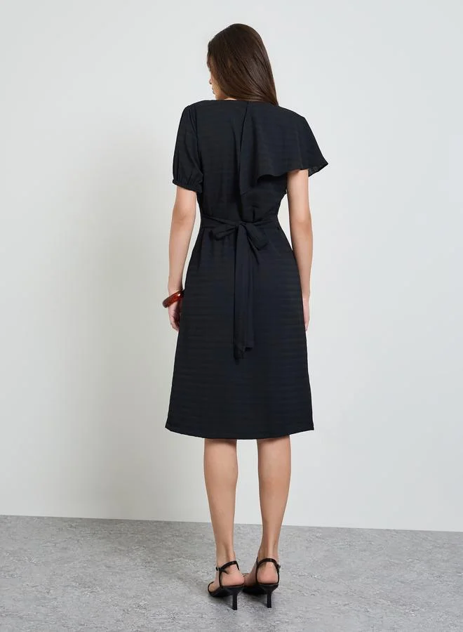 Maxim Creation black Black Textured Knee Length Dress with Frill Detail for Women | Best Price UAE