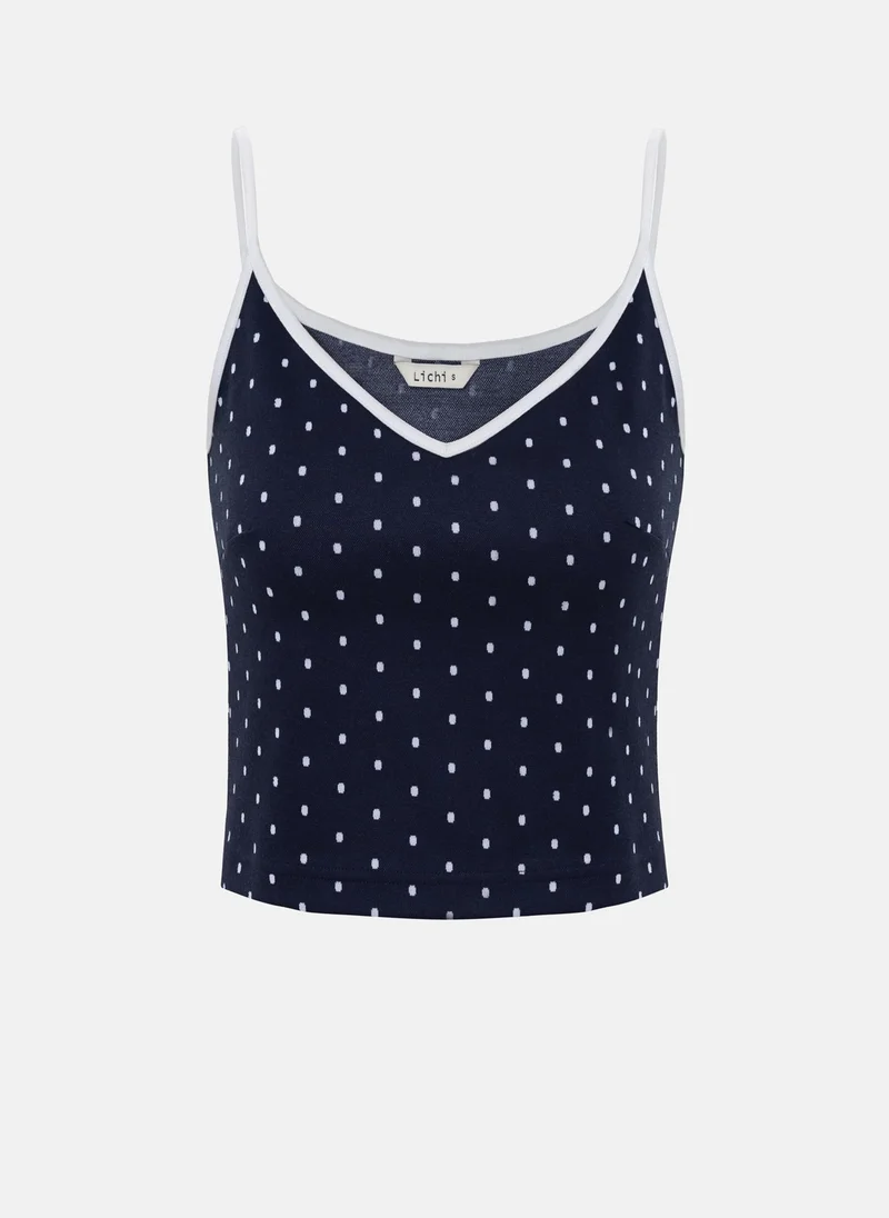 Lichi Polka dot top with contrasting details