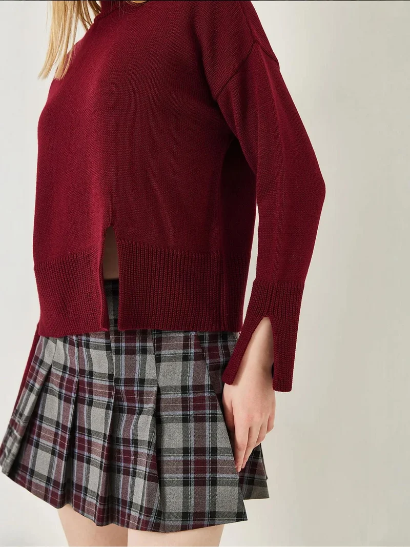 بيانكو لوتشي كنزة بياقة عالية بقصة مريحة وفتحة جانبية