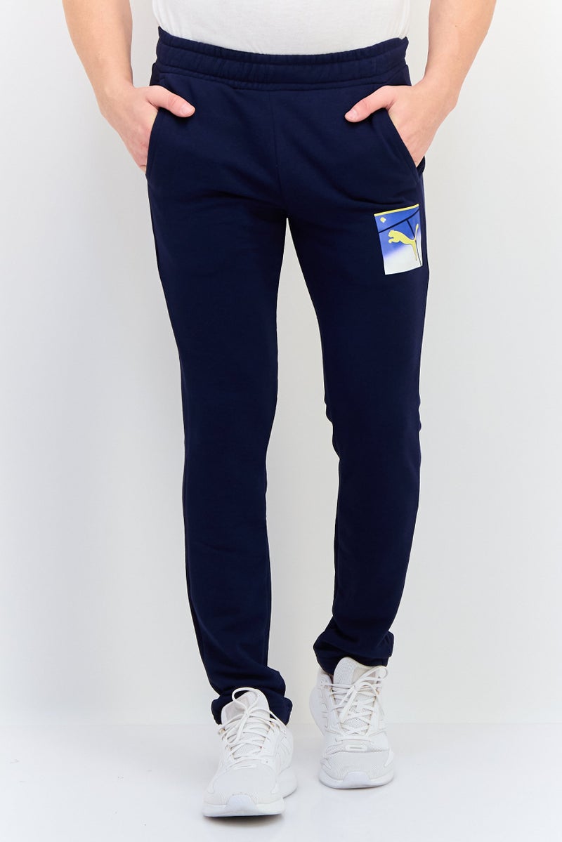 PUMA سروال رياضي للرجال برباط سحب خارجي، أزرق داكن - Image 1