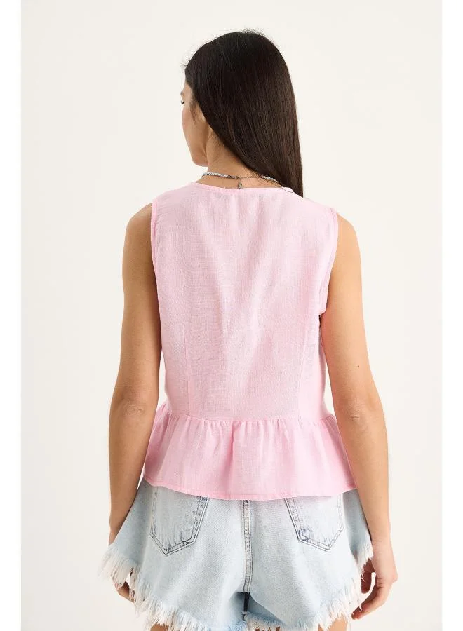 Ginger Bow Tie Up Detail Peplum Top