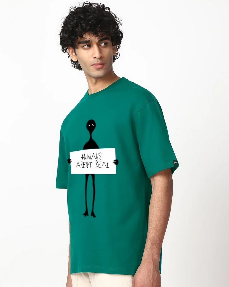 بيواكوف تيشيرت رجالي واسع بطبعة البشر ليسوا حقيقيين باللون الأخضر