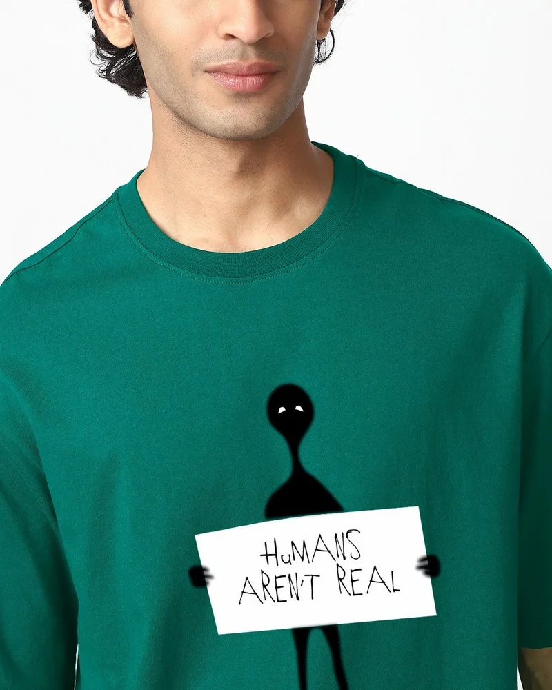 بيواكوف تيشيرت رجالي واسع بطبعة البشر ليسوا حقيقيين باللون الأخضر