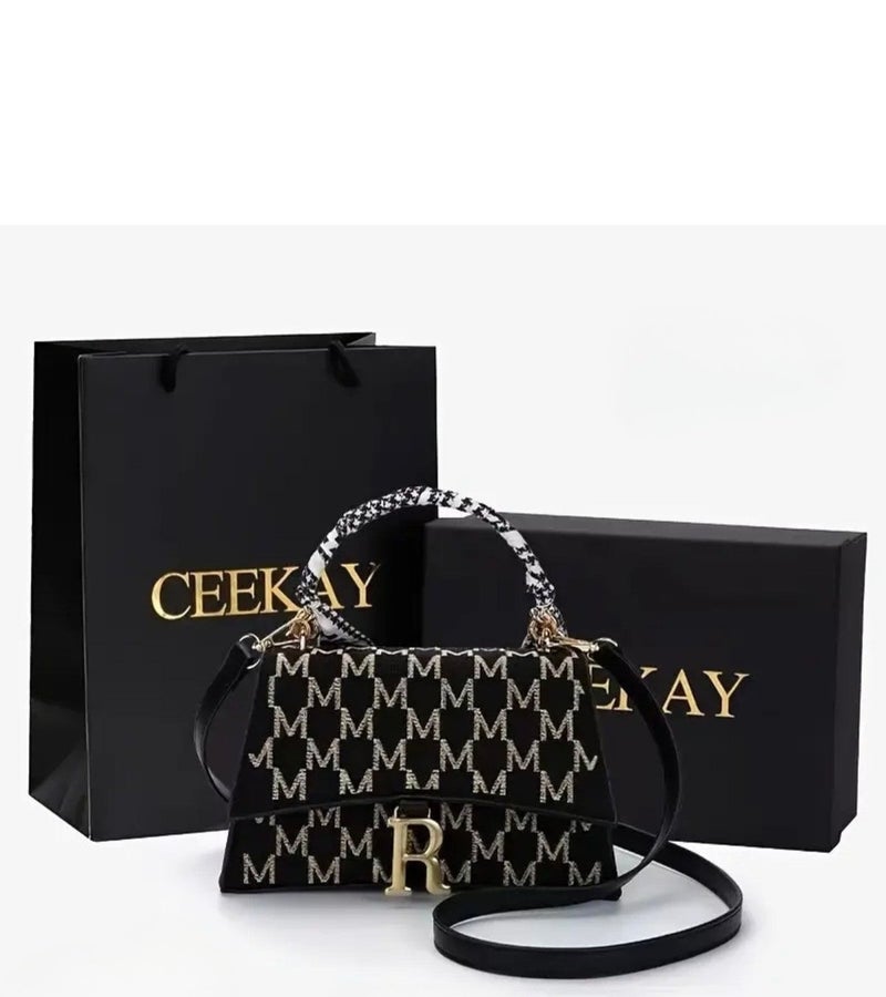 A stylish and fashionable multi-functional shoulder bag of high quality featuring the letter R and suitable for travel. It features a zipper decoration and the letter R on the body, can be carried by hand or worn on the hip, and provides ample storage space. - Image 1