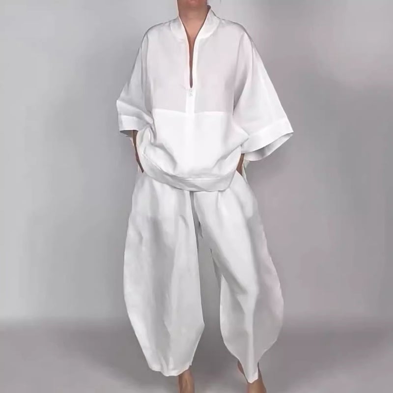 بدلة رياضية نسائية مكونة من بلوزة كاجوال فضفاضة بجيوب وسحاب نصفي مع بنطلون مزين بالورود - Image 1
