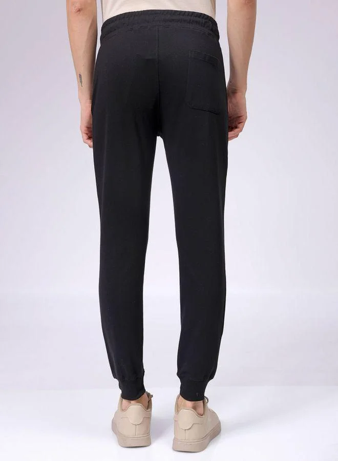 The Indian Garage Co Men Slim Fit Solid Mid-Rise Stretchable Knitted Jogger Trousers