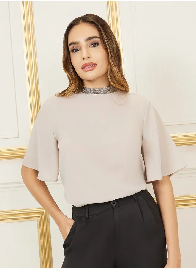 ستايلي Flare Sleeve Embellished High Neck Blouse