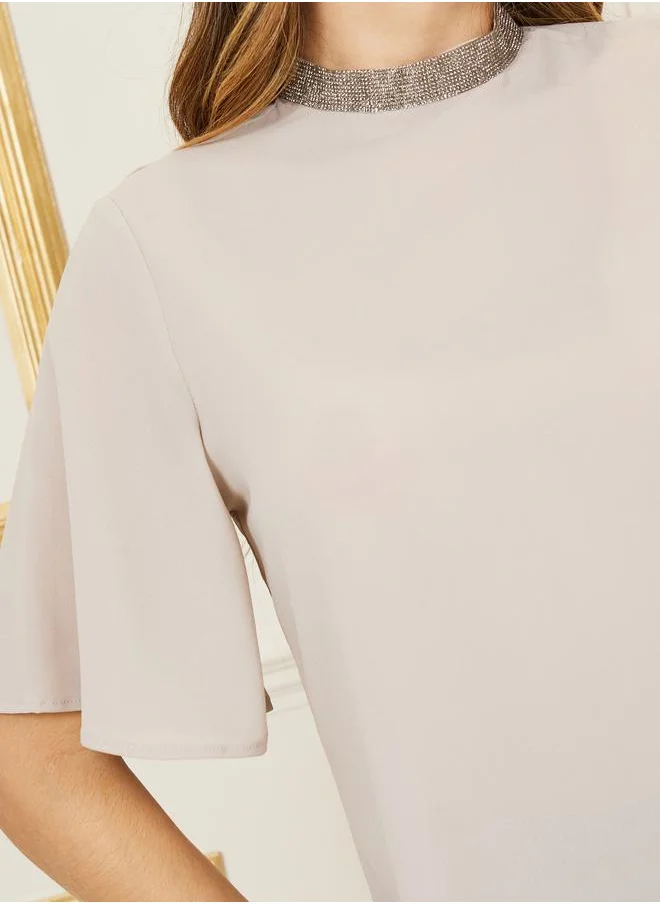 ستايلي Flare Sleeve Embellished High Neck Blouse
